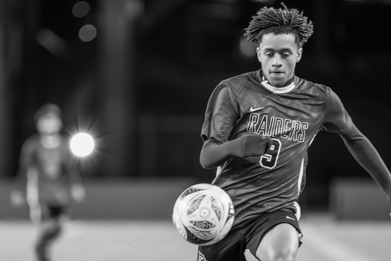 Soccer at night, black and white